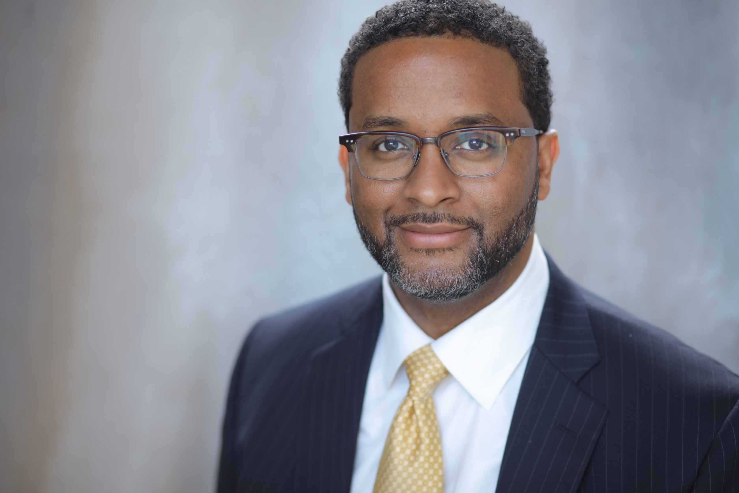 James - headshot - beard + smile + glasses - no touchup